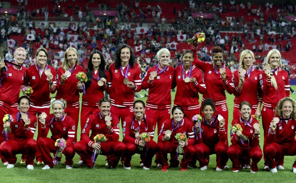 Canada's women's football team with their bronze medals at Wembley Stadium at the 2012 London Olympics, Thursday, Aug. 9, 2012. (COC Photo: Mike Ridewood)